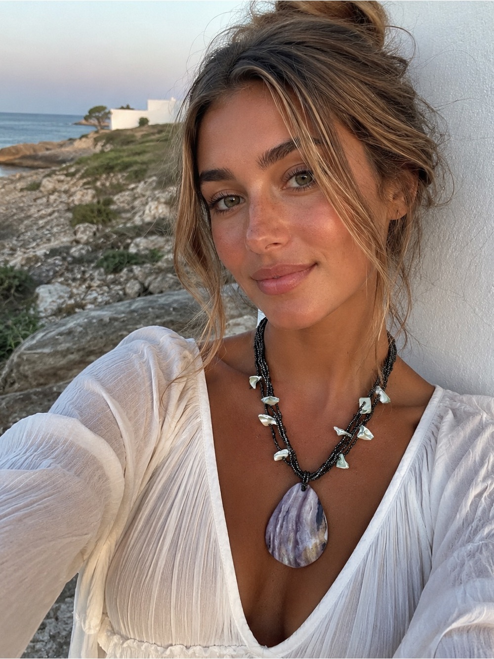 Multi-Strand Black Bead Necklace with Shell Teardrop Pendant